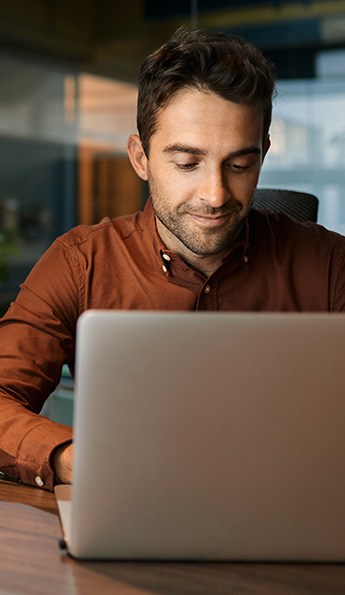 A hotel guest using SONIFI's Internet on his laptop.
